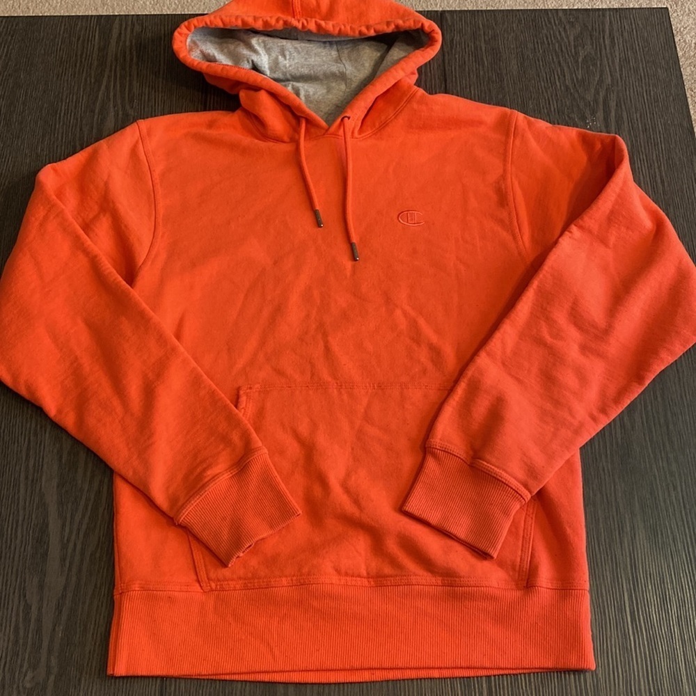 Champion hoodie. Size S. Orange with gray hood interior. Draw string.